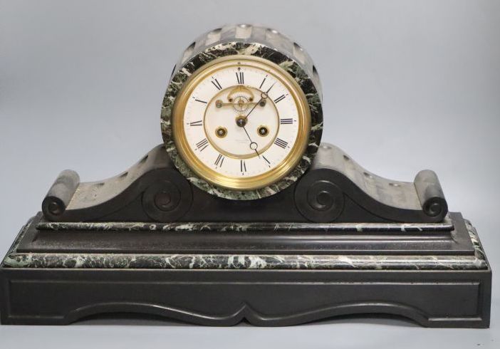 A large Victorian black slate mantel clock, with French bell-striking movement, 56cm wide